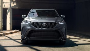 A gray 2022 Toyota Highlander is parked outside.