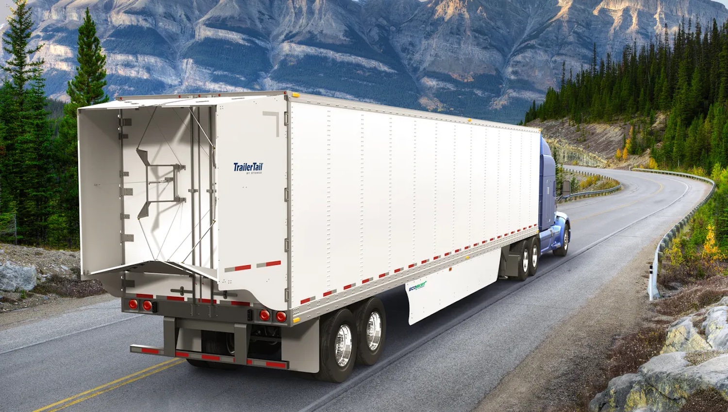 A blue semi truck tractor pulling a white trailer fitted with a Stemco TraileTail up a winding mountain road, snowcapped peaks visible in the background.