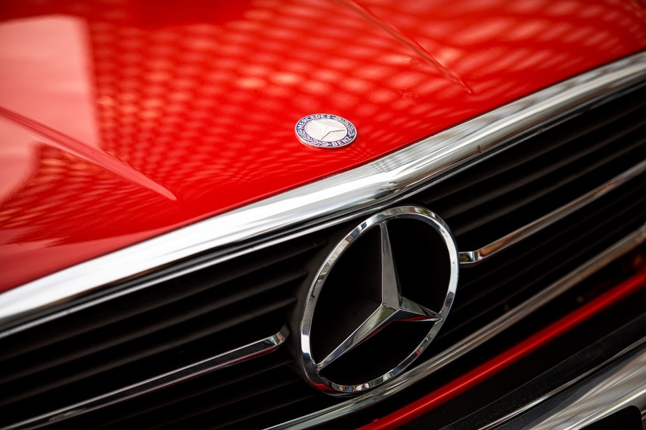 A bright red Mercedes-Benz 560SL like Donald Trump's shows off its handsome front end.