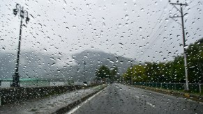 A windshield with potentially having wipers having issues when trying to get rid of water drops.