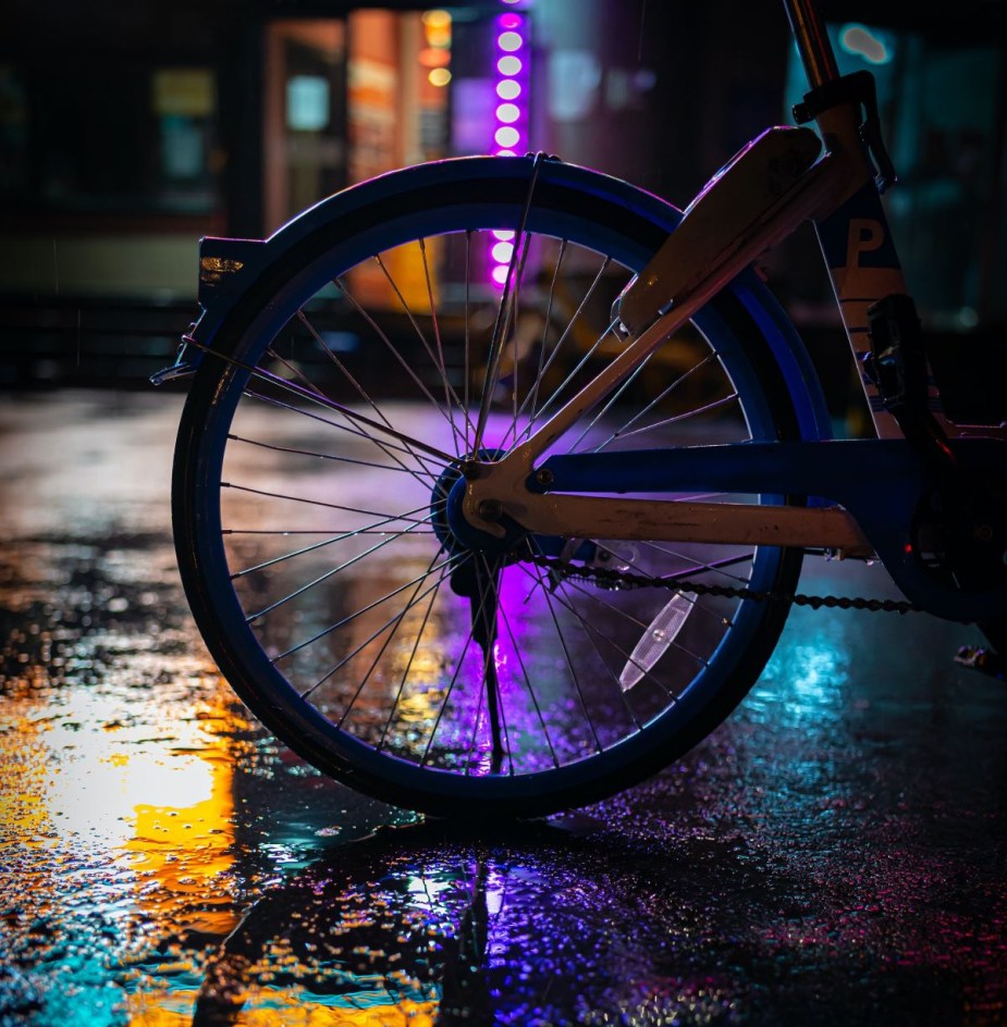 Wheel of bicycle on street in China, highlighting BMW-driving mother that mocked son's teacher for riding bike