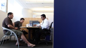 A deal being made, potential for a leased car, inside a dealership.