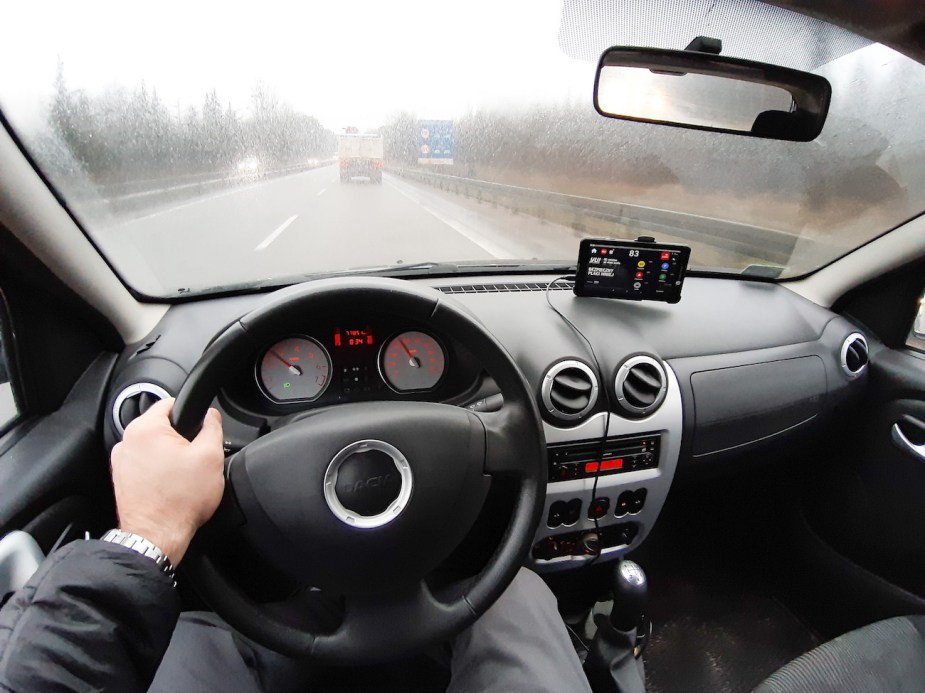 A man driving a car fast.