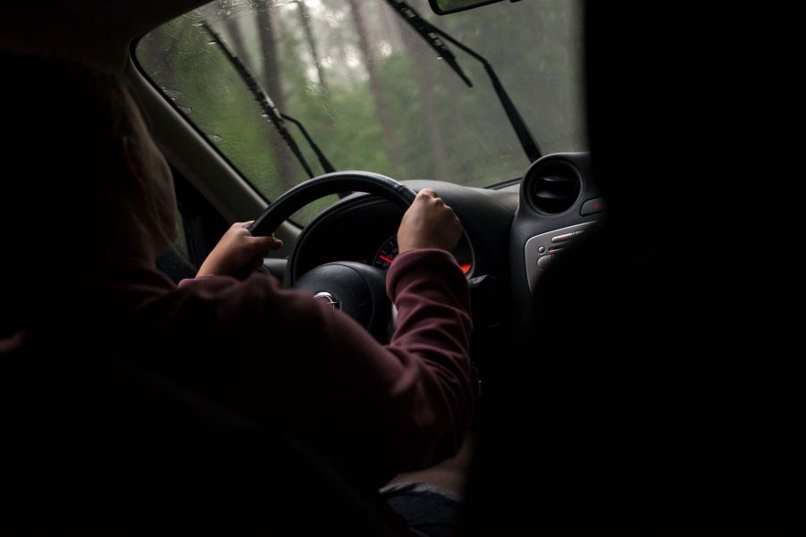 Windshield wipers operating during rain for a driver in Warsaw, Poland