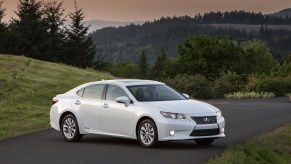 A white 2015 Lexus ES 350h hybrid sedan parked outdoors