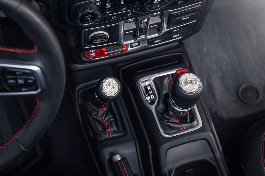 Detail shot of the automatic shift lever and transfer case 4Hi, 4Lo, and 2Hi selector lever in a Jeep Gladiator 4WD center console.