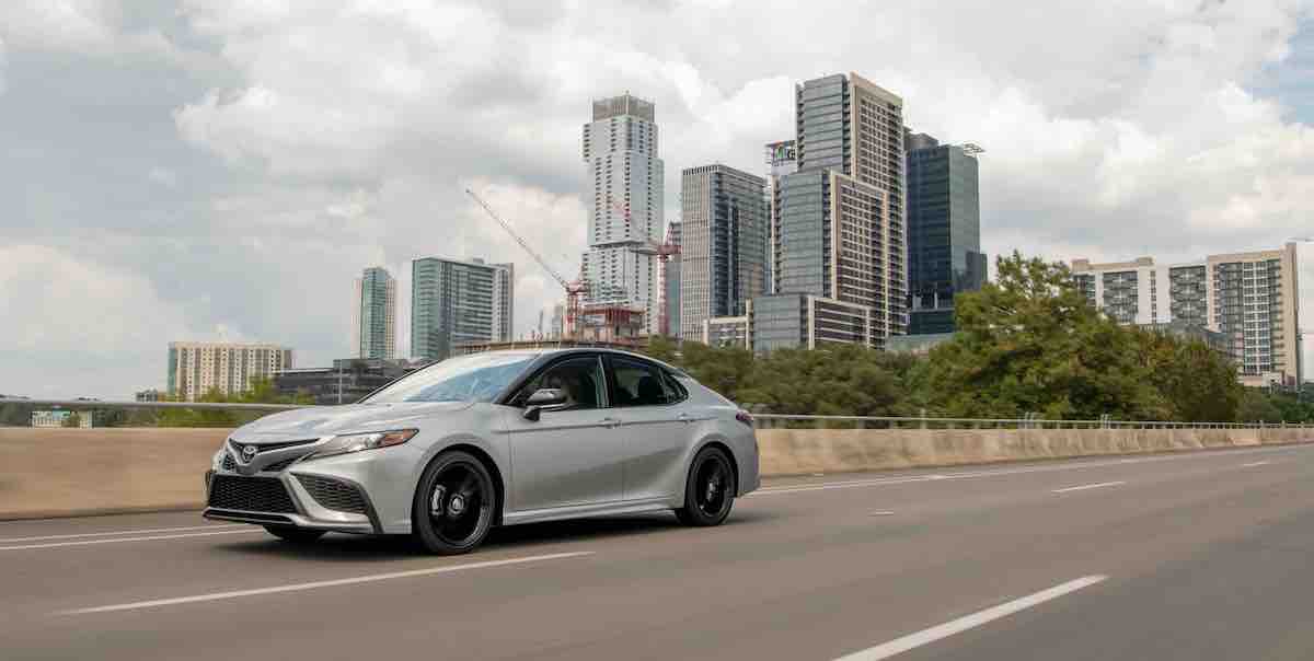 A white 2022 Toyota Camry Hybrid. 