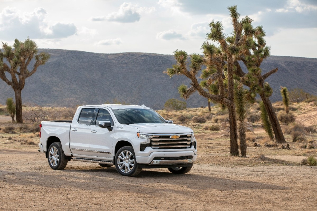 a white Chevy Silverado parked in the desert