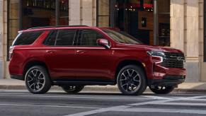 A red 2022 Chevy Tahoe. Why do experts disagree about the best trim for the full-size SUV?