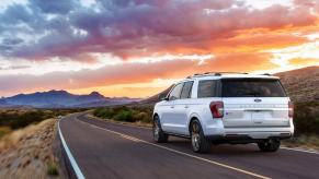 2022 Ford Expedition in white driving. There's 1 reason the Platinum trim is worth the upgrade.