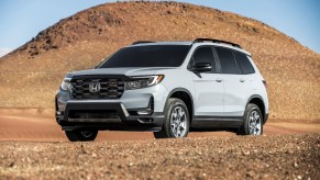 A 2022 Honda Passport TrailSport midsize SUV in the sand