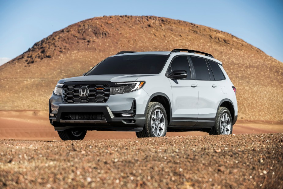 A 2022 Honda Passport TrailSport midsize SUV in the sand