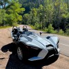 A front view of the Slingshot SL on a canyon road.