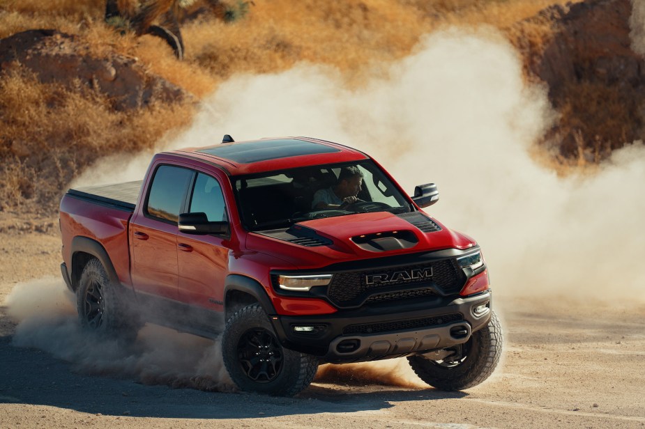 Red Ram 1500 TRX 4x4 pickup truck sliding sideways while off-road.