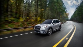 A silver 2022 Subaru Forester Compact SUV driving