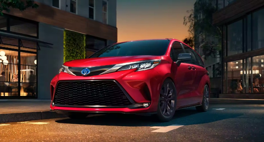 A red 2022 Toyota Sienna minivan is parked. 