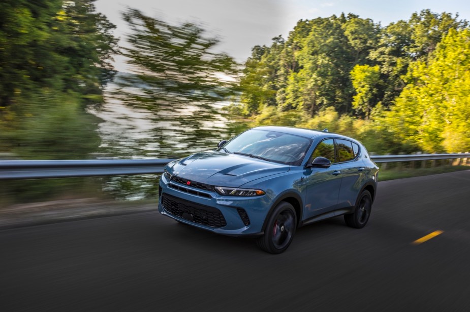 A light blue 2023 Dodge Hornet GT driving