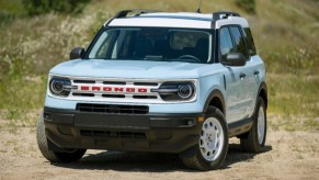 A blue 2023 Ford Bronco Sport Heritage small off-road SUV is parked outside.