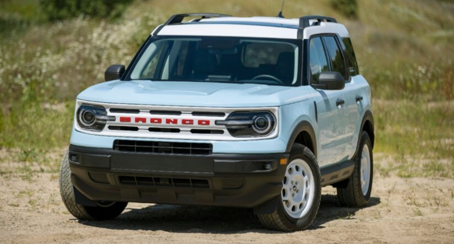 A blue 2023 Ford Bronco Sport Heritage Edition is parked outside. 