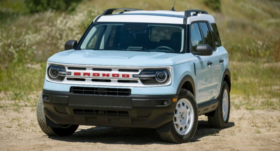 A blue 2023 Ford Bronco Sport Heritage small off-road SUV is parked outside.