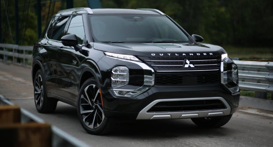 A black 2023 Mitsubishi Outlander PHEV. 