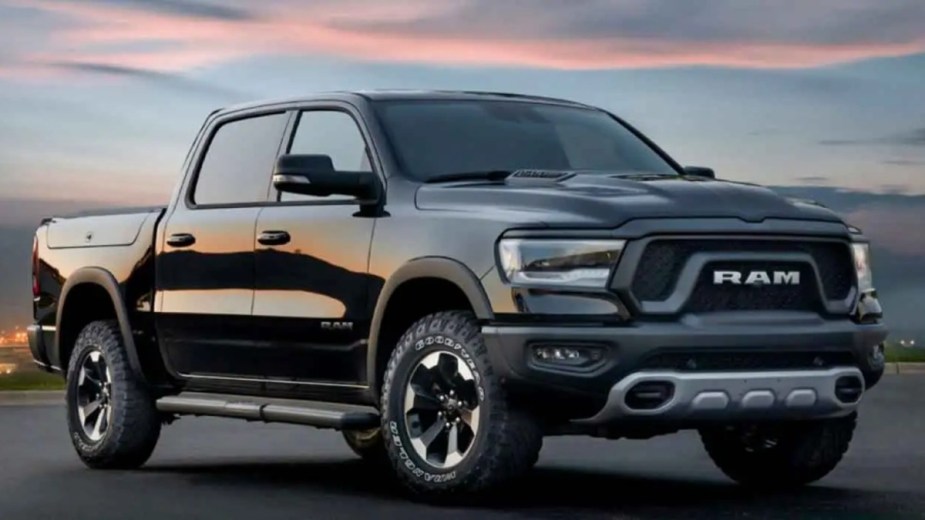 Black 2023 Ram 1500 Limited Elite with sunset background