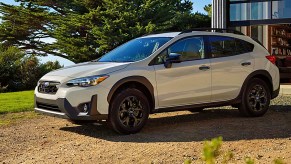 A white 2023 Subaru Crosstrek is parked outdoors.