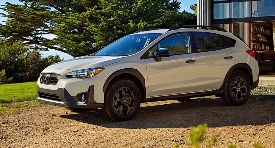 A white 2023 Subaru Crosstrek subcompact SUV is parked outdoors. 