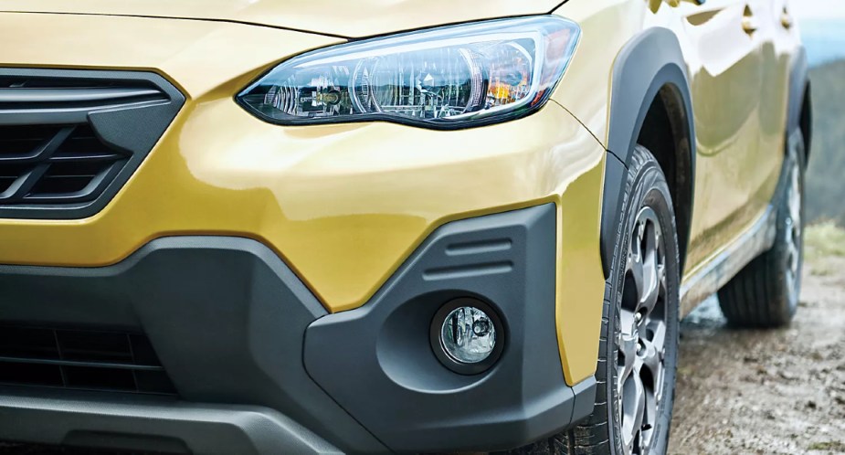 The front of a yellow 2023 Subaru Crosstrek subcompact SUV. 