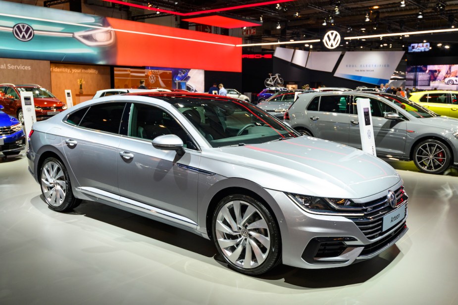 A silver 2023 Volkswagen Arteon parked indoors. 