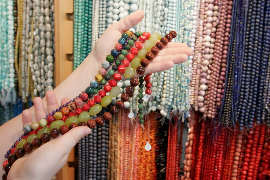 A group of beads, similar to those used to make car beads, which was a car accessory made popular by cab drivers.