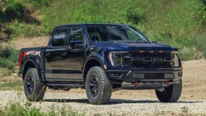 Blue 2023 Ford F-150 Raptor R posed on a trail