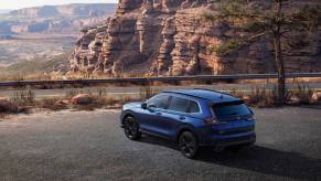 Blue 2023 Honda CR-V crossover SUV parked on a scenic overlook