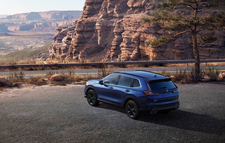 Blue 2023 Honda CR-V crossover SUV parked on a scenic overlook