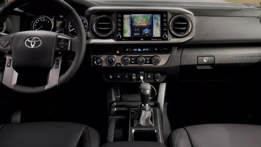 Dashboard and front seats in 2023 Toyota Tacoma, highlighting how much a fully loaded one costs