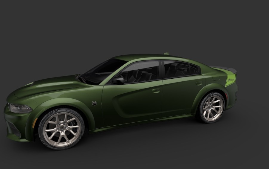 A dark green 2023 Dodge Challenger Last Call Special Edition car against a black background.