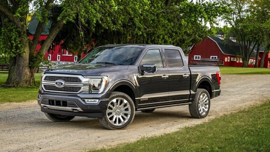 Gray Ford F-150 Limited Parked in front of a farm