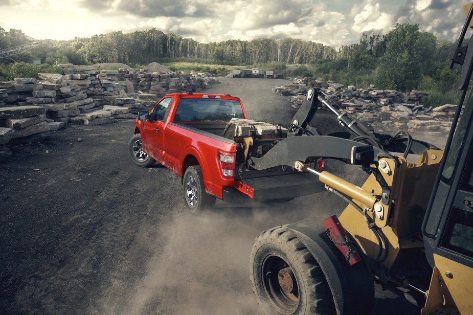 A 2022 Ford F-150 XL shows off its capability as a full-size truck at a job site.