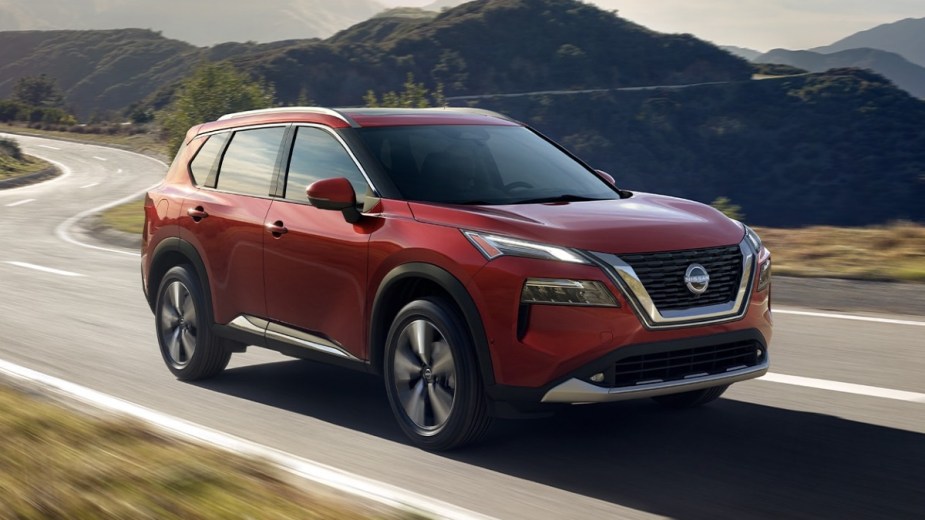 Front angle view of new red 2023 Nissan Rogue crossover SUV, highlighting how much a fully loaded one costs