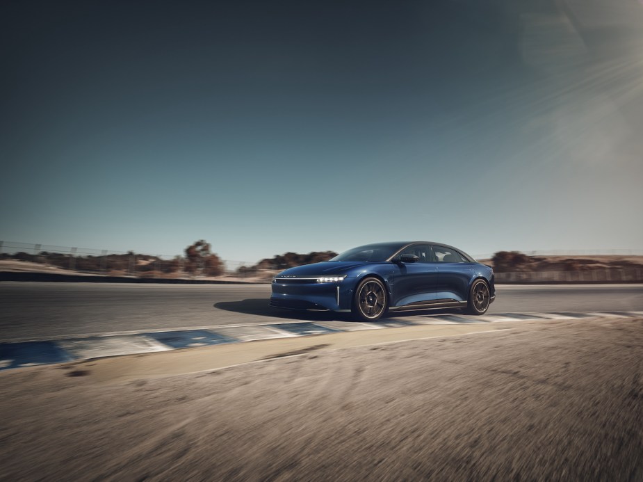 A Lucid Air Sapphire driving around a corner