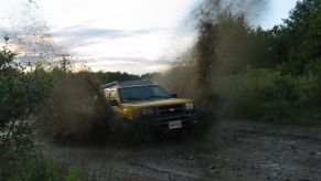 A Nissan Xterra shows off its capability as an off-road SUV.