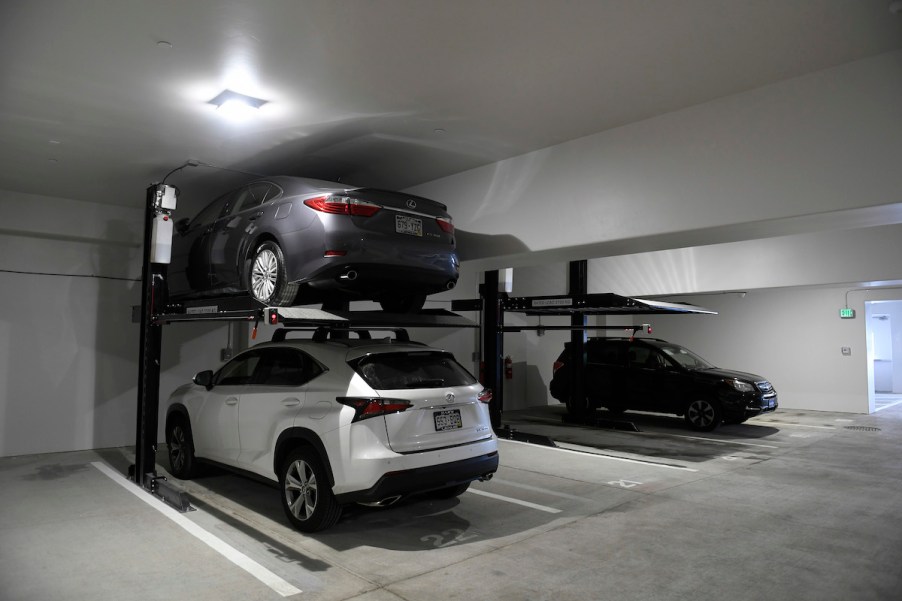 A parking lift inside of a garage.