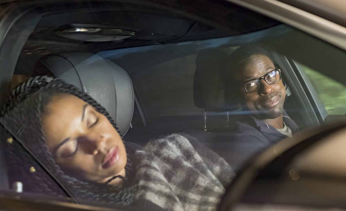 A person sleeping in a car that could initiate a road trip game.