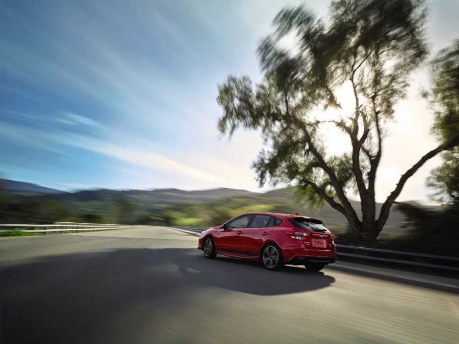 Rear angle view of new red 2023 Subaru Impreza