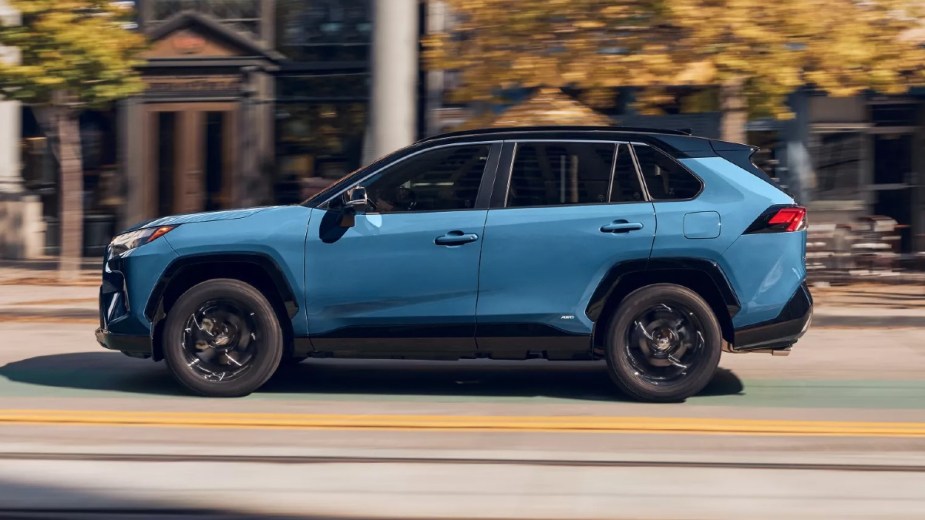 Side view of Cavalry Blue 2023 Toyota RAV4 crossover SUV