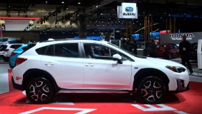 A White Subaru Crosstrek at an auto show