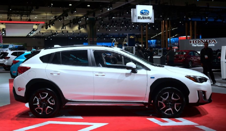 A White Subaru Crosstrek at an auto show