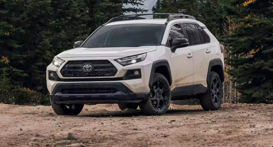 A white Toyota RAV4 small SUV is parked outdoors. 