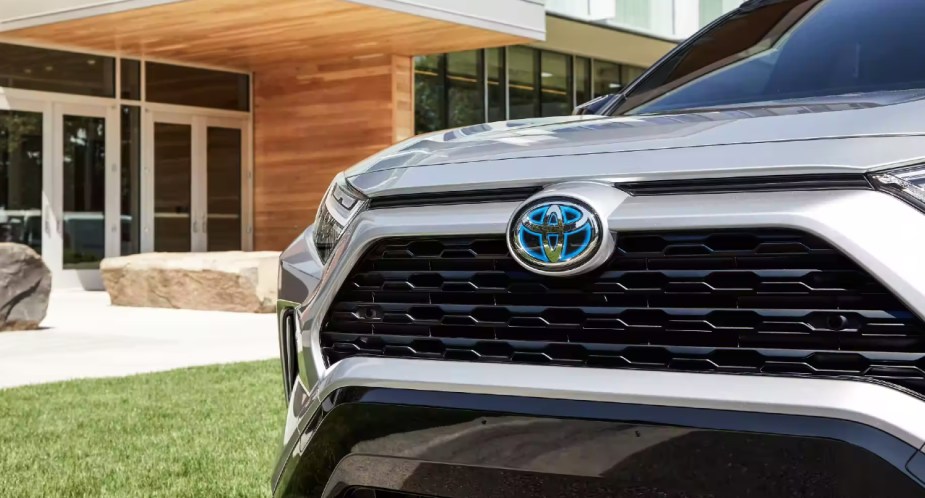 The front of a white 2022 Toyota RAV4 Hybrid. 