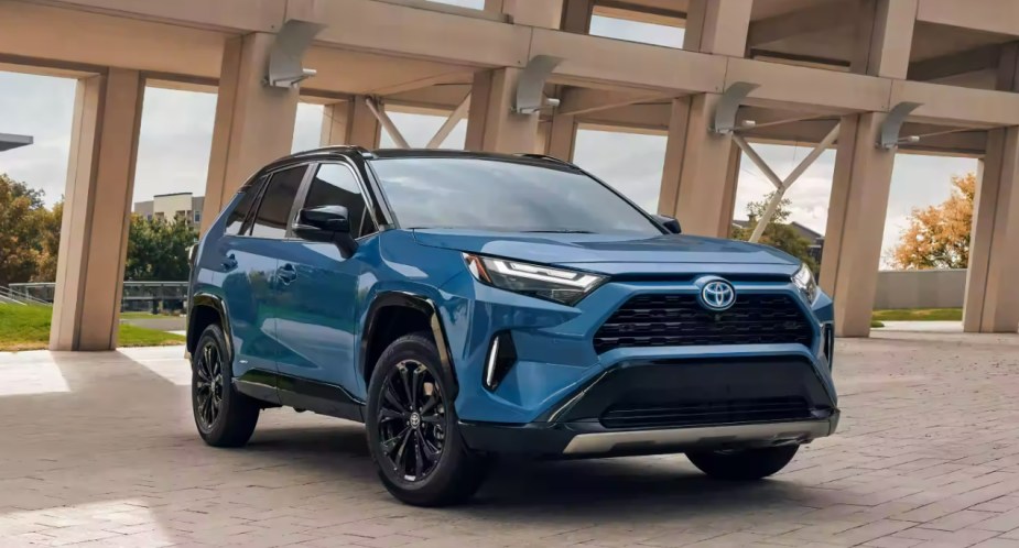 A blue 2022 Toyota RAV4 Hybrid small SUV is parked.